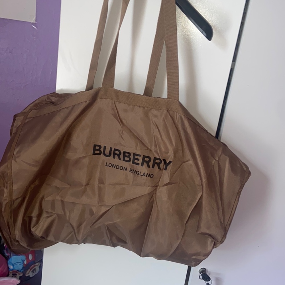 Burberry suit bag can also be used as a duffle bag